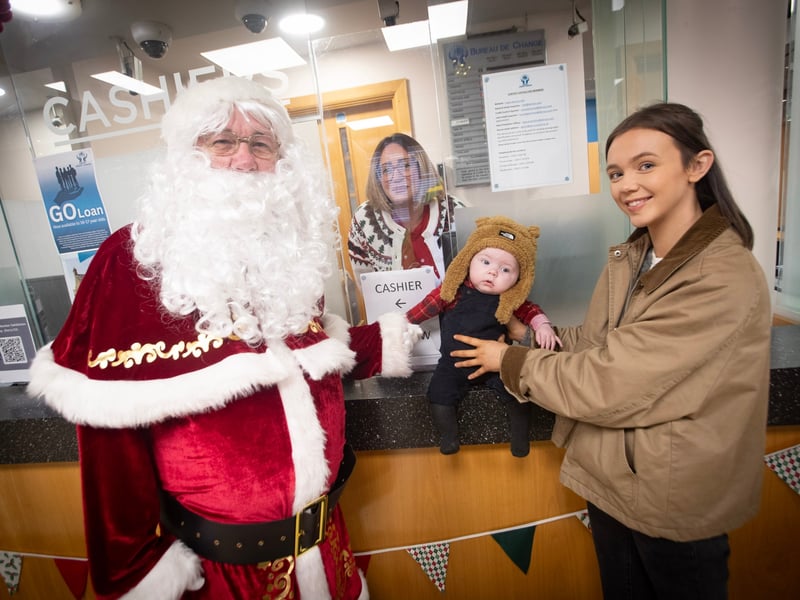 One of the youngest members getting a photo with Santa Claus during Saturday's event at the Derry Credit Union.