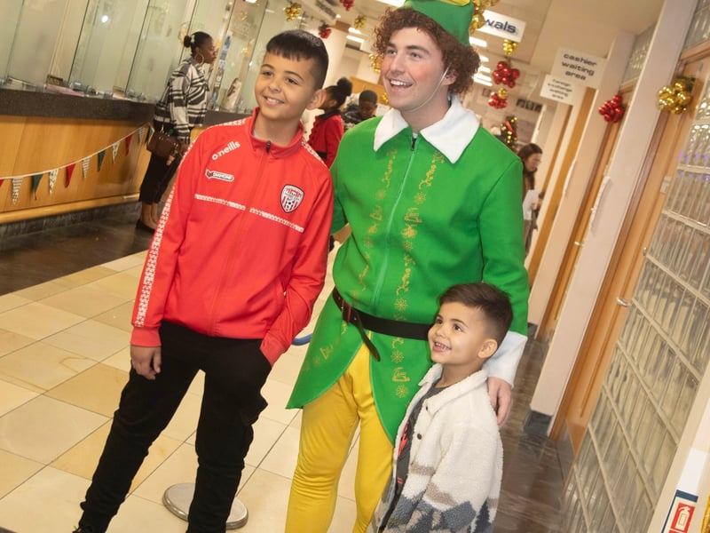 These two young chaps happy to grab a photo with Santa's Helper on Saturday at Derry Credit Union.