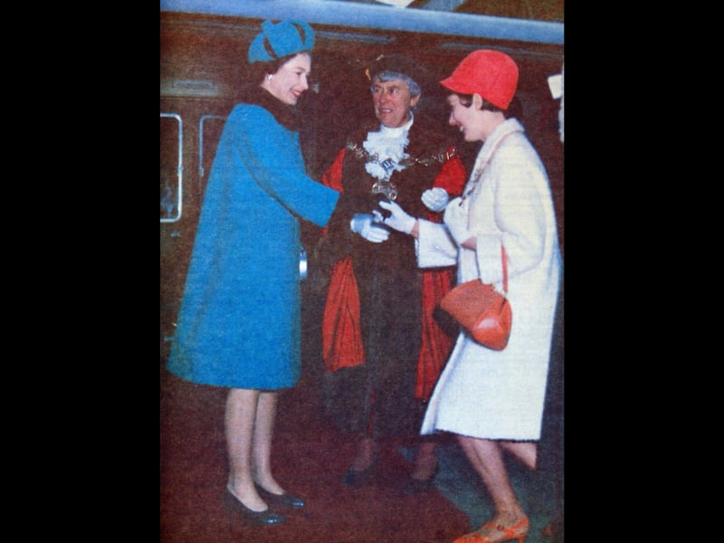 The Queen visits Shrewsbury on 17 March 1967, arriving at the railway station where she is presented to the Mayoress of Shrewsbury, Miss P.M. Lancaster, in the presence of the Mayor, Alderman Mrs E.M. Lancaster. This historic image was the first colour photograph taken by a British newspaper and published on the same day it was captured.