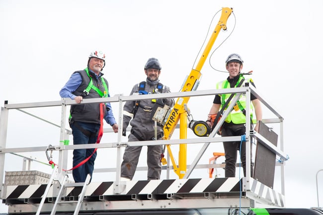 L-R; Trade Safety owner Austin Handy, Alan Veale and Cormac Delaney on top of the company's new confined space mobile training unit.