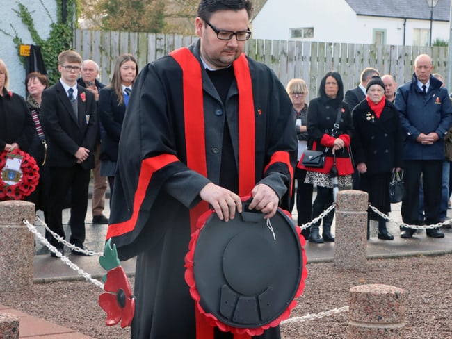 Councillor Lee Kane pictured laying a wreath at Ballycastle’s War Memorial.