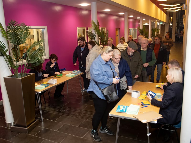 Queuing at St. Mary's College on Monday night for the Derry Credit Union AGM.