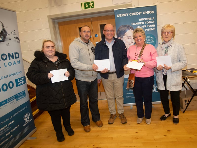 Gerry McMonagle, Derry Credit Union, presenting £25 prizewinners at Monday's AGM. From left Ciara O'Reilly, Sean-Paul Brinkley, Frances Meenan and Grace McKenna.