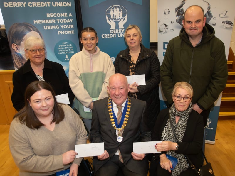 Derry Credit Union president Colm McCauley presenting the £100 prizewinners at Monday night's AGM. Front from left, Colleen Wilson and Bridie Barr. Back from left, Brigid McKeegan, Lauren Clifford, Donna Heaney and Kevin Kelly.