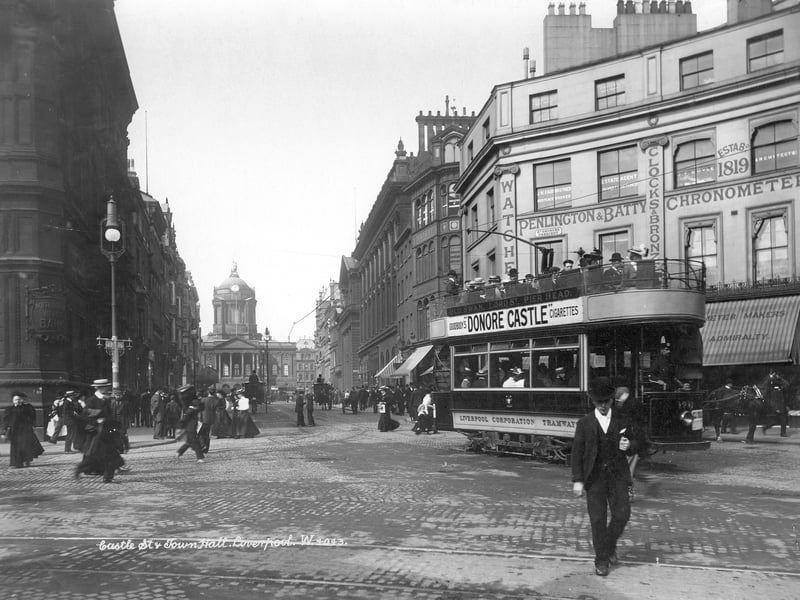 Castle Street, Liverpool, seen from Derby Square, sometime between 1890 and 1910, looking towards the town hall, with pedestrians and a tramcar. The street was widened in 1786 and remains one of the widest streets in Liverpool.