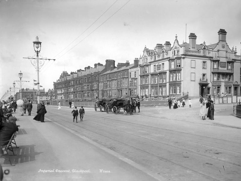 Imperial Crescent, Blackpool, pictured sometime between 1890 and 1910, with pedestrians and horse-drawn vehicles, as well as tramlines, in the foreground