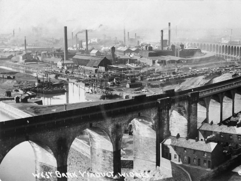 The West Bank Viaduct, Widnes, Cheshire, in around 1920. The bridge over the Mersey between Widnes and Runcorn cut nine miles off the journey between Liverpool and London. The approach to this was a 59 arch viaduct that cut through Widnes to become one of the town's most prominent monuments to its industrial heritage.