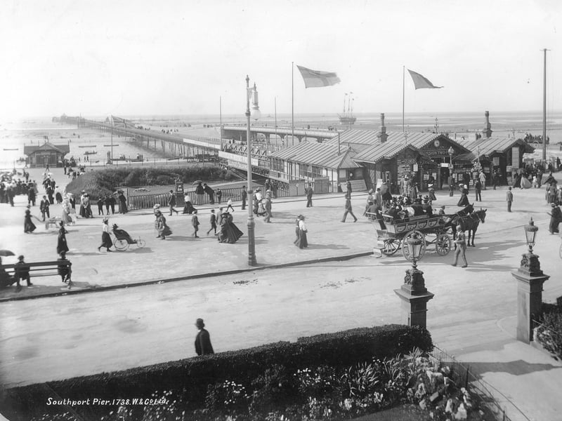 Southport Pier, Southport, pictured sometime between 1890 and 1910 showing holidaymakers and a horse-drawn vehicle