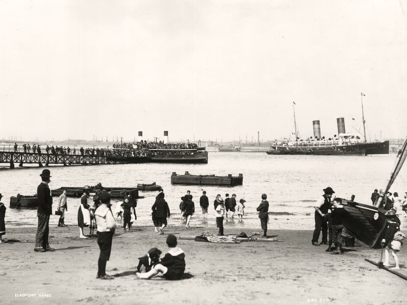 Holidaymakers playing on The Sands at Egremont, Cheshire, in around 1910
