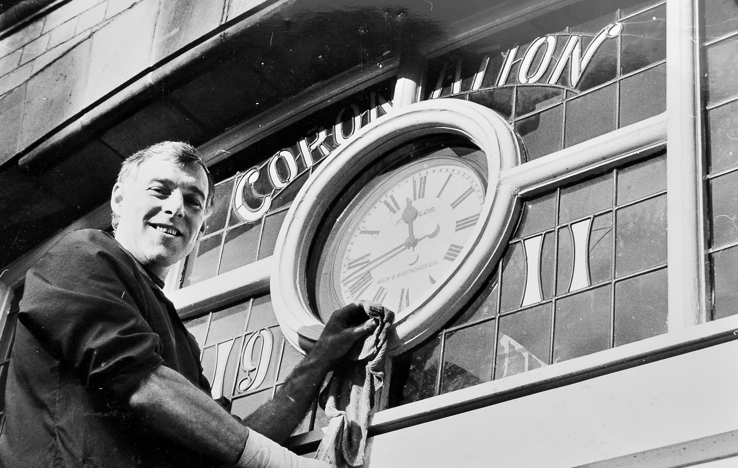 Wem Town Hall in 1983, with caretaker Michael Maddocks pictured alongside the historic clock that had kept time for the town since 1911. After years of repairs, the ageing timepiece was finally deemed too inaccurate and put up for sale as a collector’s item — marking the end of an era for local residents.