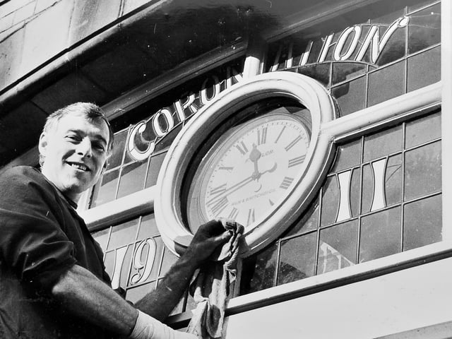 Wem Town Hall in 1983, with caretaker Michael Maddocks pictured alongside the historic clock that had kept time for the town since 1911. After years of repairs, the ageing timepiece was finally deemed too inaccurate and put up for sale as a collector’s item — marking the end of an era for local residents.
