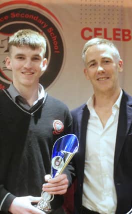 Pictured below: Waterford Football Manager Paul Shankey presents the Senior Sportsperson of the Year award to David Comerford.