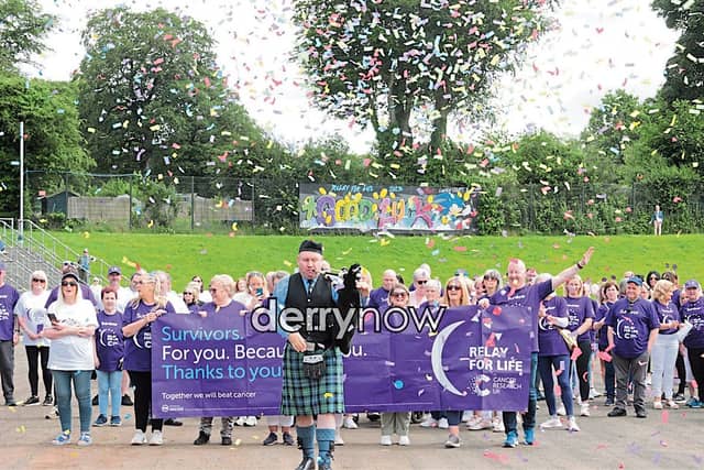 Colin Campbell, Garvagh Pipe Band, leads the Survivors and Carers along St. Columb's Park running track for the start of the Legenderry Relay for Life Parade. (Photos - Deirdre Heaney, nwpresspics)
