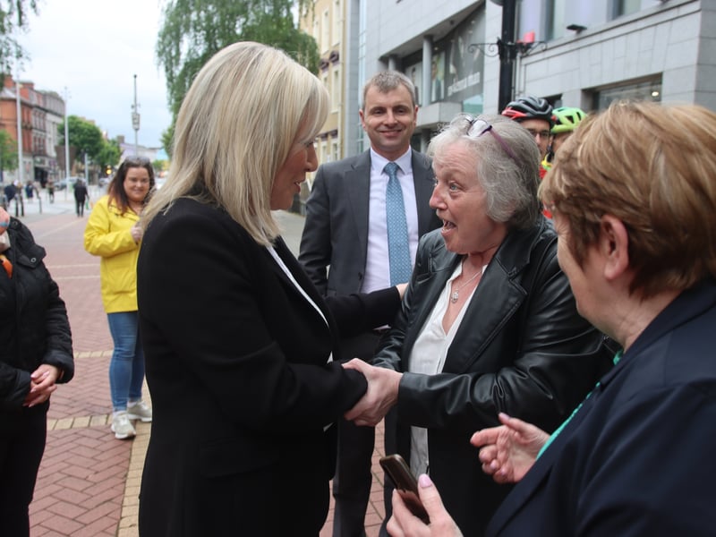 Cara Cancer Support’s Anna Brennan meets First Minister Michelle O’Neill in Earl Street on Friday watched by Michelle Gildernew MP (left), Deputy Ruairí Ó Murchú and Kate Corrigan.