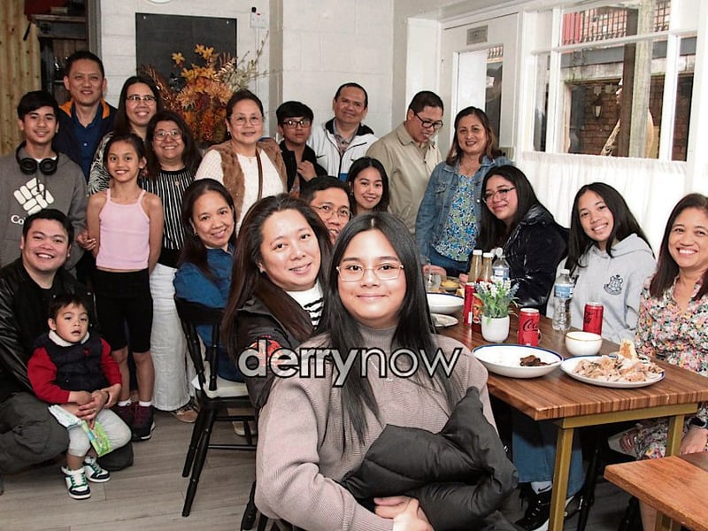 Families enjoying the opening of the Filipino restaurant, Bahay Kusina.