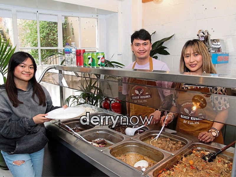 Hannah, Jason Paul and Krishtine serving up the food.