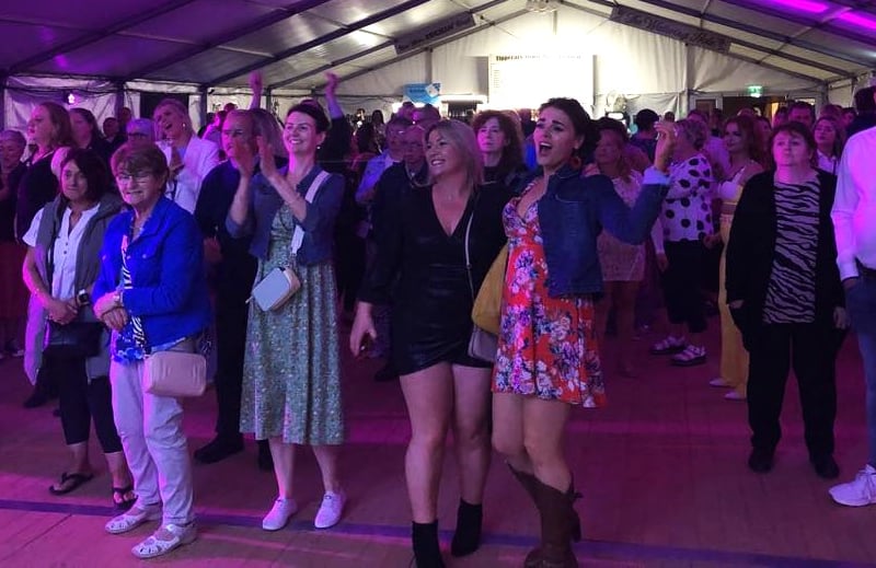 A packed crowd singing along to Rebecca O'Connor as Tina Turner at the Tipperary Festival