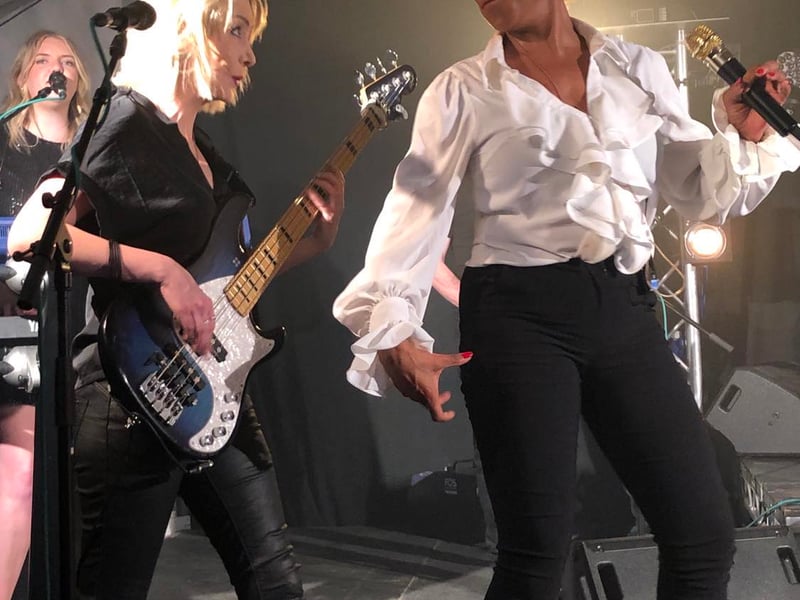Rebecca O'Connor as Tina Turner pictured on stage with some of her band members performing at the Tipperary Festival