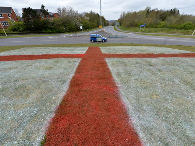 St George's flags had been dyed into the grass at several Telford roundabouts ahead of St George's Day in 2021. Pictured is Old Park roundabout.