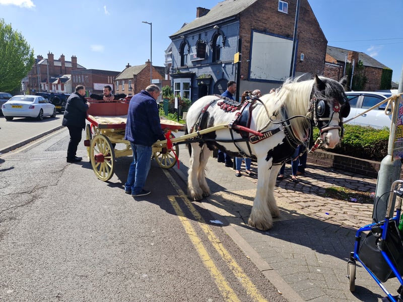 There were horses and carts outside as people listened in to the funeral