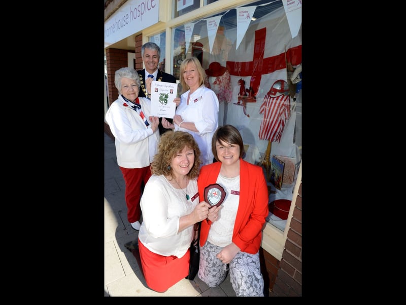 St George’s Day celebrations in Newport town centre, 2016. Former Mayor Eva Allan and current Mayor Cllr Tim Nelson present staff from Katharine House Hospice with the award for best St George’s window display. Pictured with Angela Kelly, Anne Jones and Amy Machin (front).