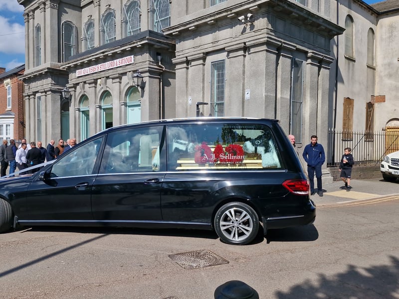 The hearse arrived with members of Hubert's family following behind