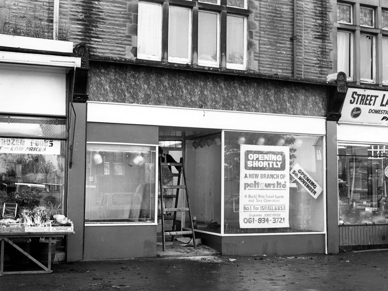 A travel agents being fitted out for its 5th November opening in 1979. On the left of the business is a grocery while on the right is an electrical shop.