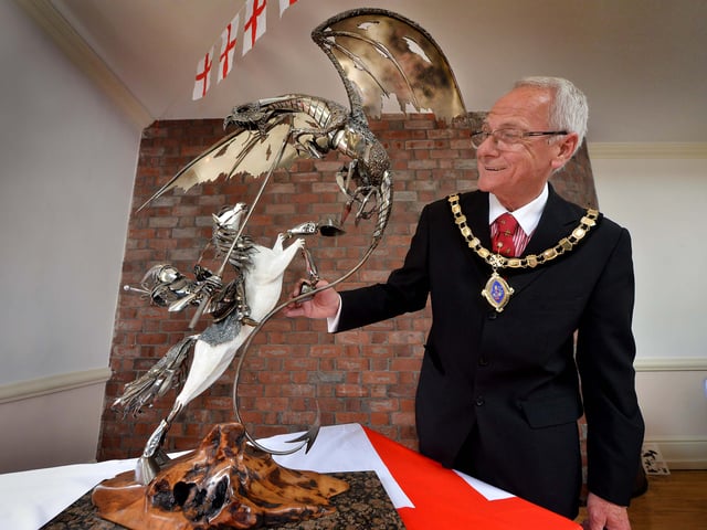 Oswestry, 2016. At a celebration event for England and St George at the Wynnstay Hotel, Mayor Peter Cherrington is pictured with a sculpture by Clive Knowles of the British Ironworks, Oswestry.