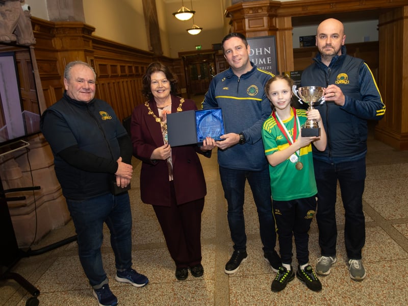 The Mayor of Derry City and Strabane District Council, Patricia Logue making a special presentation to Don Boscos Colts u-13 manager Aaron Starrs to mark the successful season the team had this year, winning the D&D League One Winter Cup and runners-up in the League One Summer Cup. Included from left are coaches Vinny Brady and Peter Doherty and at front, team captain Kayla Starrs.