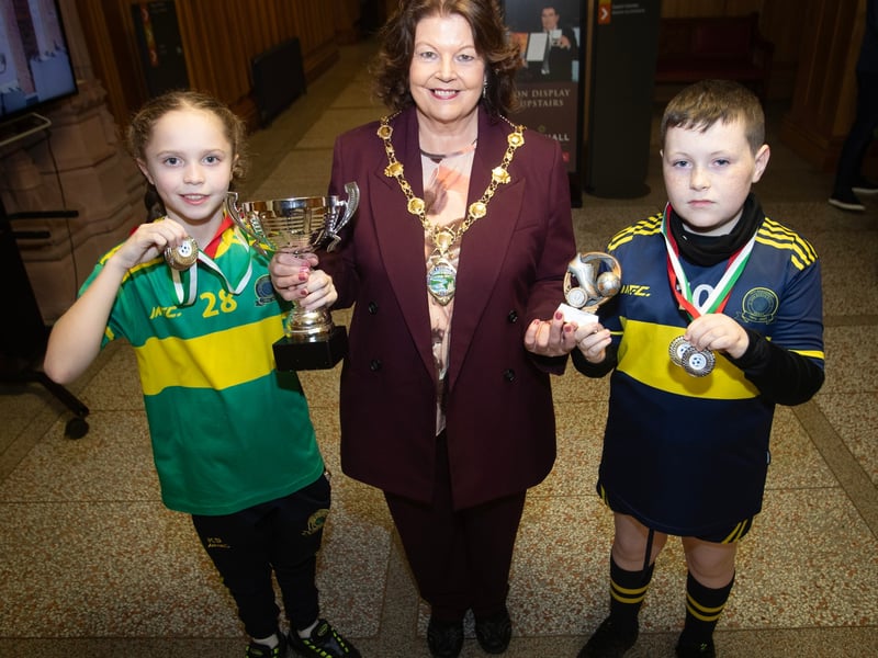 WELL DONE!. . . . The Mayor, Patricia Logue pictured with Don Boscos Colts captain Kayla Starrs and the D&D Winter Cup and D&D player of the year Damien Meehan, during Monday's event in the Guildhall.