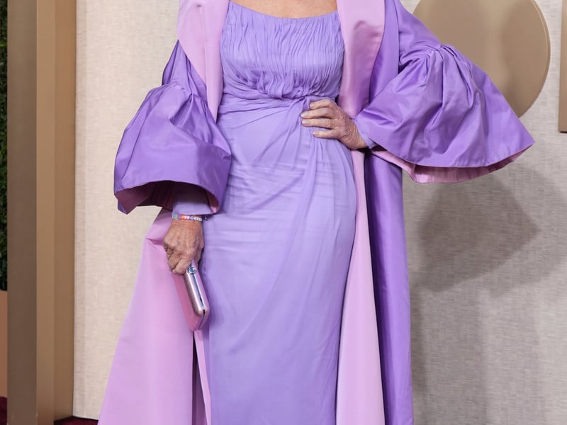 Music and movie star Jennifer Lopez was pretty in pink, donning a showstopping Nicole + Felicia gown with huge 3D rosette sleeves and a long train.