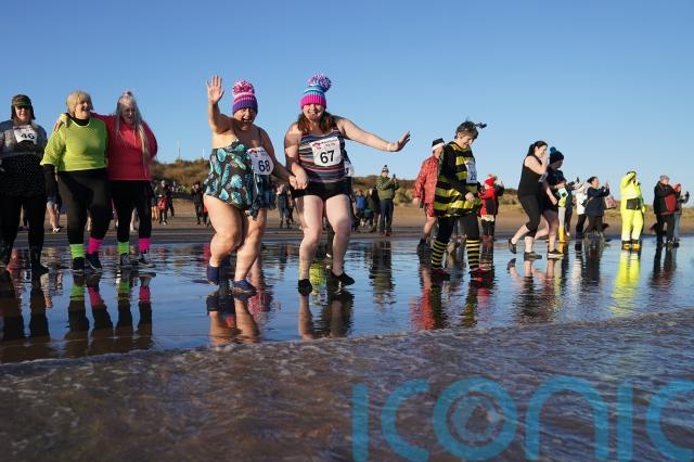 From the Loony Dook in Scotland to the New Year’s Day Dip in Gosport, revellers in fancy dress and swimming outfits took the plunge.