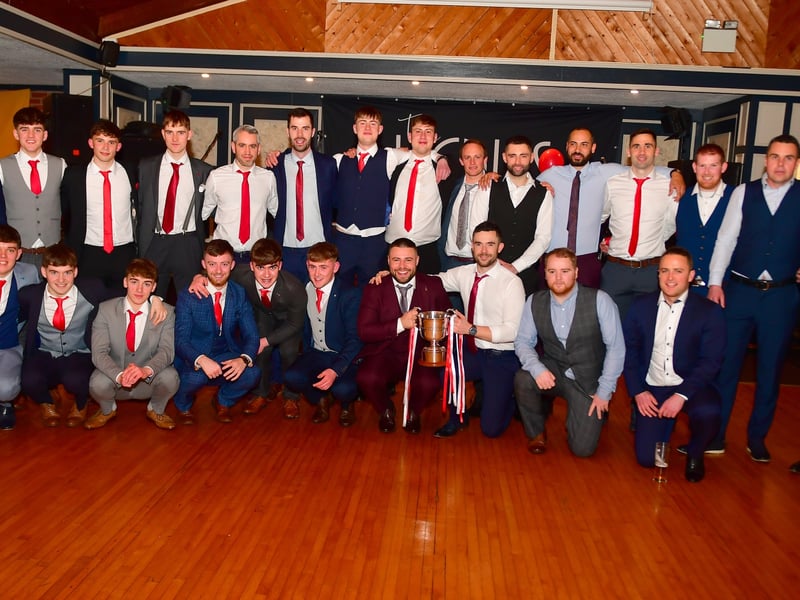 Caption: Members of the Ballymahon squad, Longford Intermediate Football Championship winners 2022 pictured with the Gerry Hennessy Cup at last Saturday's club dinner dance and presentation in the Rustic Inn, Abbeyshrule Picture: Frank McGrath 