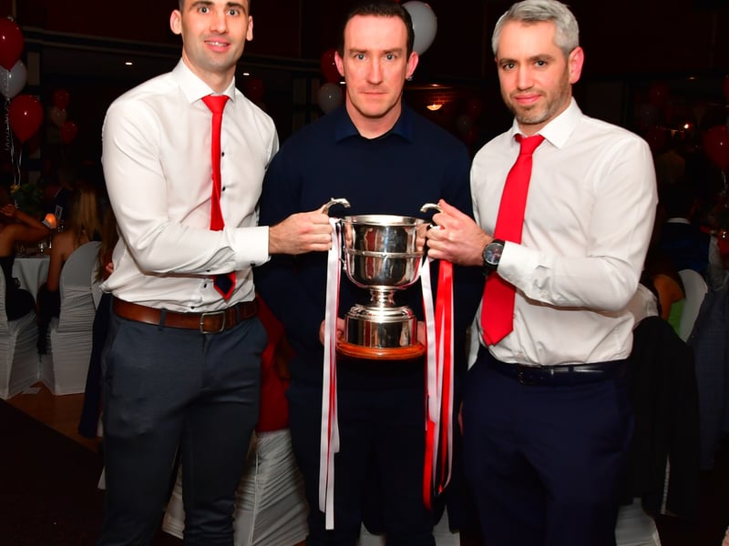 Caption: Longford manager Paddy Christie (centre) with Ballymahon Joint captains Kevin Diffley and Emmet Finn and the Gerry Hennessy Cup Picture: Frank McGrath 