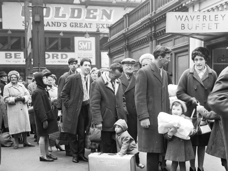 Passengers queue for the holiday special train at Waverley Station, Edinburgh, during the spring holiday in April 1966