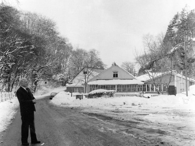Wrekin, March 1970: A wintry scene at the Forest Glen with snow covering the landscape. The unidentified man in the picture stands amid the winter setting, captured in a quiet moment of seasonal stillness.