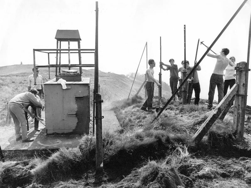 Work takes place to remove the old Wrekin beacon, with assistance from RAF Shawbury personnel. The team is pictured dismantling the structure on or around August 27, 1970.