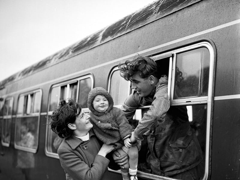 A soldier from Black Watch says goodbye to his wife and daughter from the train at Mid Calder railway station, as he leaved for the regiment's tour of duty in Northern Ireland in August 1970