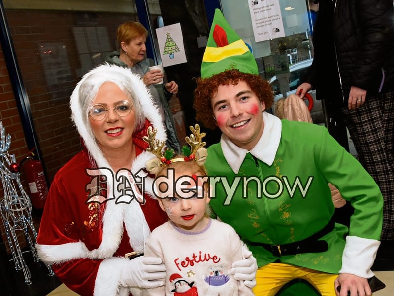 Katie Deehan with Mrs Claus and Buddy The Elf pictured at Derry's Credit Union Santa Saturday