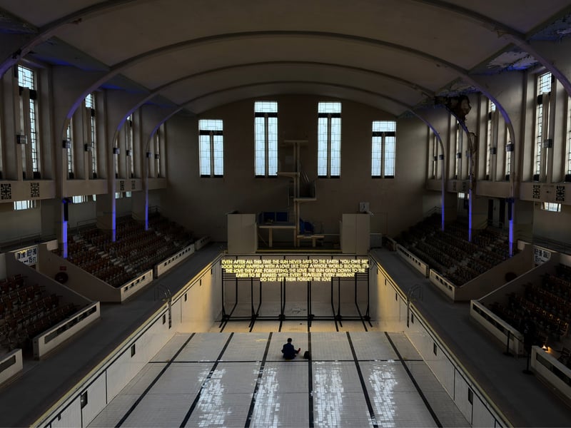 Robert Montgomery has created two works for Nuart 2026, marking his return to Aberdeen with a first for the festival. The Scottish artist has created this temporary installation inside Bon Accord Baths, which reads “Even after all this time the sun never says no the the earth ‘you owe me’ / Look what happens with a love like that a whole world blooms, it’s the love they are forgetting, the love the sun gives down to the earth to be shared with every traveller every migrant / Do not let them forget the love”. He has a second work for the festival which can be found on Thistle Lane, with his 2017 piece on Jopps Lane.
