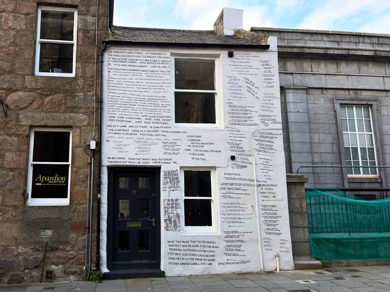 Little Belmont Street is then home to another piece from The Writing Is On The Wall, dubbed the “poetry house”. A temporary installation, there are many small poems painted across the white front of the building. 
