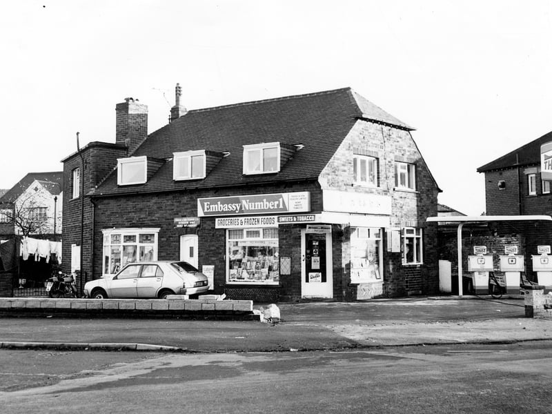 Harrogate Road seen at the crossroads of Harrogate Road and Victoria Avenue with Bayton Lane and Yeadon High Street. Semi detached houses in Moorland Drive off Bayton Lane are visible in the background. Pictured in November 1979.