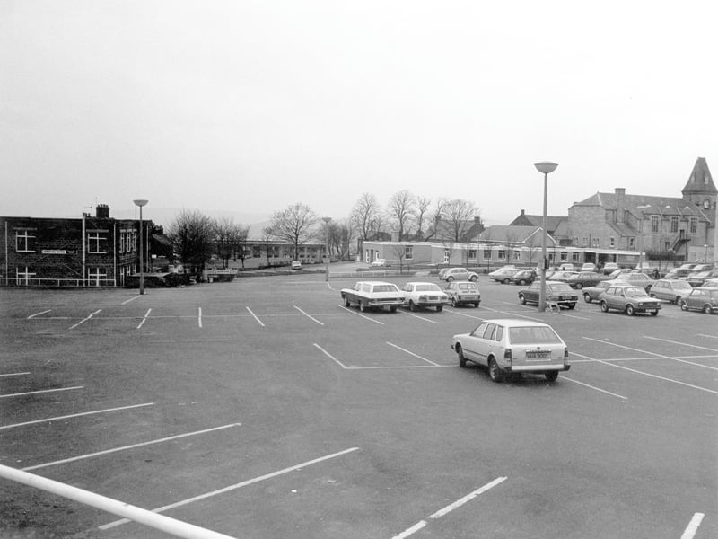 Morrisons car park looking towards South View Road where Yeadon Health Centre can be seen. On the left is the Trades Hall Social Club, now demolished to make way for Morrisons petrol station. To the right is Yeadon Town Hall which has its frontage on Town Hall Square in the High Street. Pictured in December 1979.