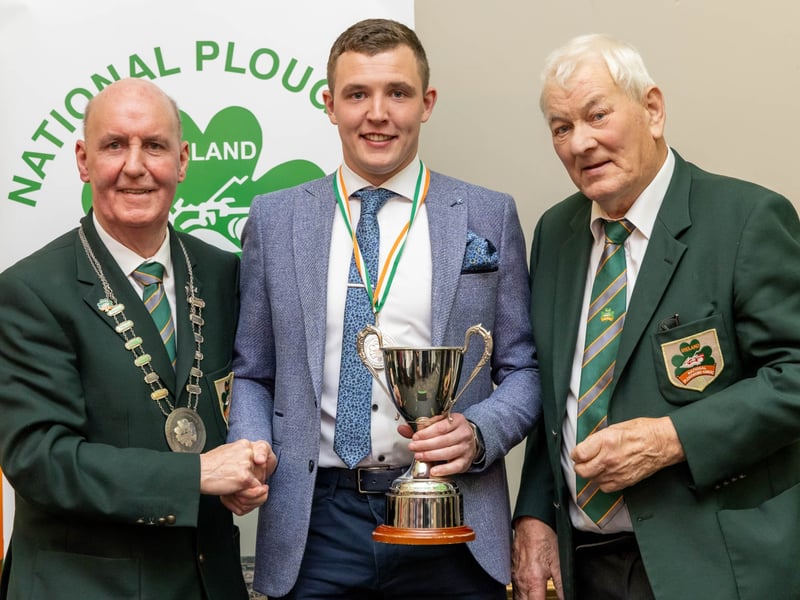 John Murphy from Carlow is presented with NPA Perpetual Cup and silver medal for Intermediate Conventional by NPA president James Sutton and chairman Mick Mahon at the National Ploughing Association awards and banquet in Portlaoise. Picture: Alf Harvey