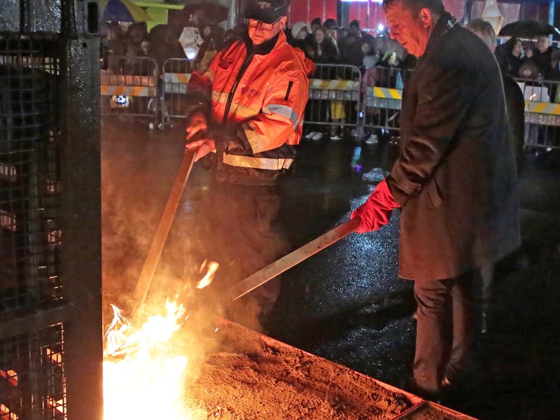 Caption: Cllr Gerry Hagan lighting the Halloween bonfire at the Dead of Night Festival 