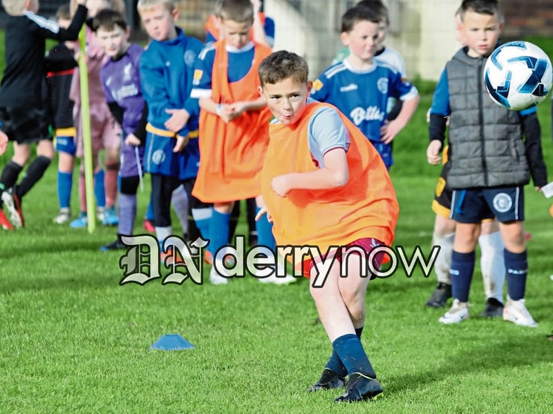 This young footballer blasts this ball towards the target at the Trojans YCG Halloween Soccer Camp.