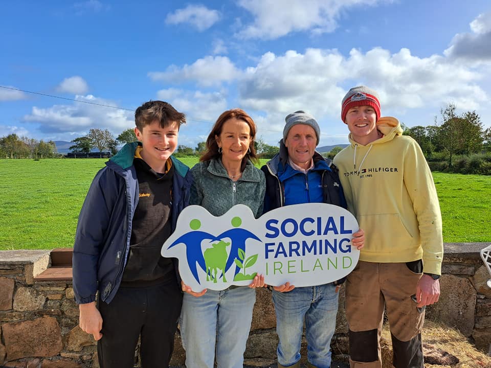 The sun shone bright for the second day of National Social Farming Awareness Week 2023 when Richard and Áine Galway held a very successful Social Farming Open Day on their beautiful farm outside Thomastown. It was a great gathering of participants, services, neighbours and friends and farmers, some of whom had travelled from as far as Waterford, Tipperary and Kildare. All were keen to gain an insight into what Social Farming is all about and to what the Galway farm has to offer to participants. Social Farming is about providing opportunities and activities on ordinary family farms as a form of social support. People come to a social farm, usually one day a week, and get to be part of whatever is happening on the farm on that day, with huge benefits and real outcomes across multiple dimensions of health and well-being. “Our social farms are both ordinary and extraordinary places,” noted Social Farming Ireland National Coordinator Helen Doherty, speaking during the week. “They provide such huge variety and choice for people regardless of their interests or capacities. People can get involved in every kind of activity, from caring for animals to walking the land to growing food from seed to harvest to maintenance activities like scraping the yard or power washing to cooking in the farm kitchen.”