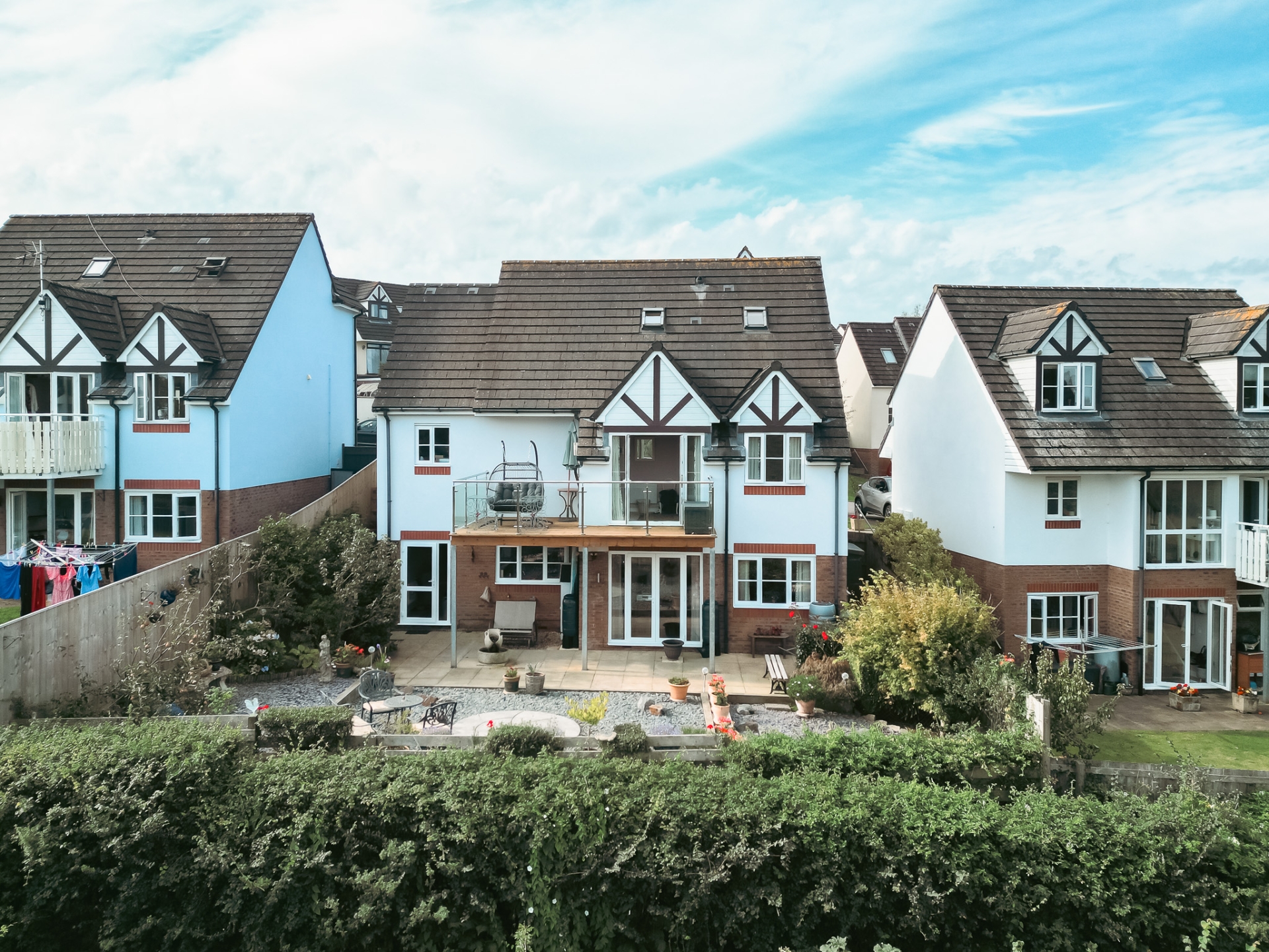 Outside, the front has mature shrubs, plants, lawn and a generous driveway with space for at least two cars. There is an integral double garage with power, light and up-and-over doors.