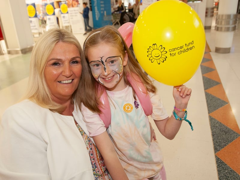 Showing their support for Friday's Lisnagelvin Shopping Centre's Annual Great Family Fun Day in aid of charities is seven years-old Eimear Wilson and her grandmother Eileen Breen.