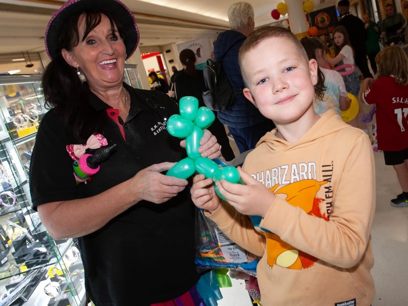 Balloon Lady Kate Carlyle pictured with 8 years-old Callum Campbell at the Lisnagelvin Shopping Centre's Annual Great Family Fun Day in aid of charities Cancer Fund for Children and ME4 Mental Health Support and Suicide Prevention.